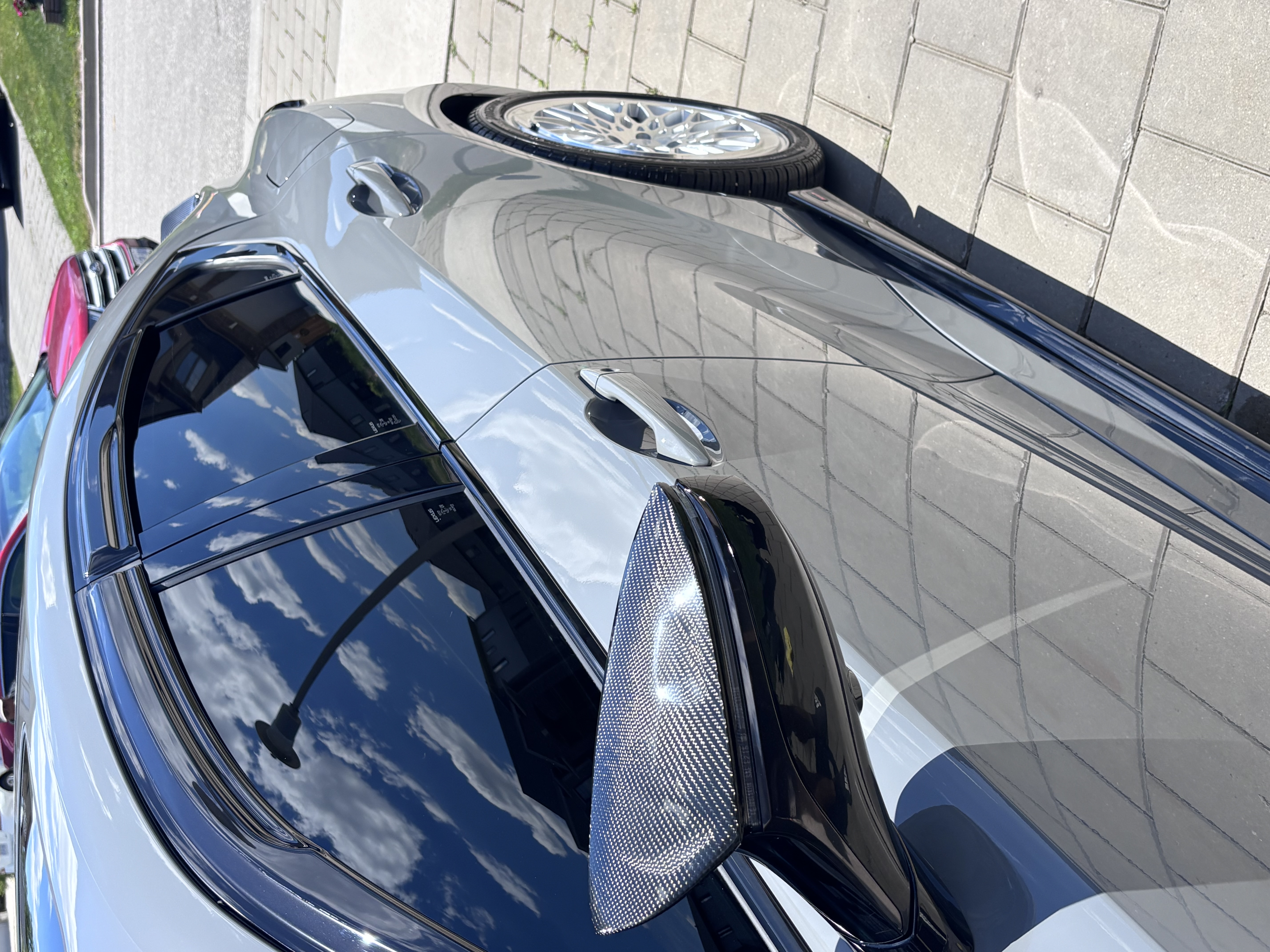 Elite Finish Auto detailing a vehicle on-site in a driveway